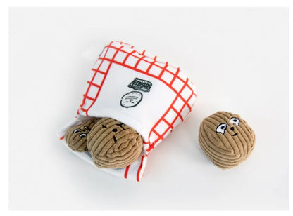 Dog sniffing toy set with two walnut pieces, one peanut piece and snack bag with rustling paper