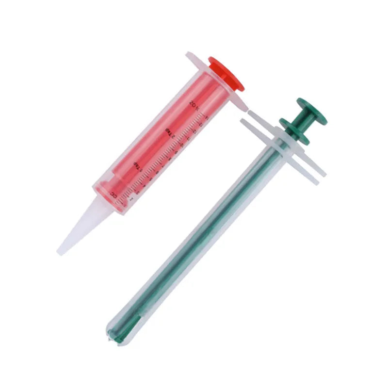 Two silicone-tipped pet pill shooter syringes for cat and dog medicine.