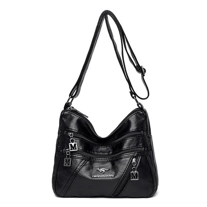 Middle-aged women's double layer PU shoulder bag with large capacity, welt pocket, and soft build in red, purple, dark blue, black, bronze, gray, or tan.