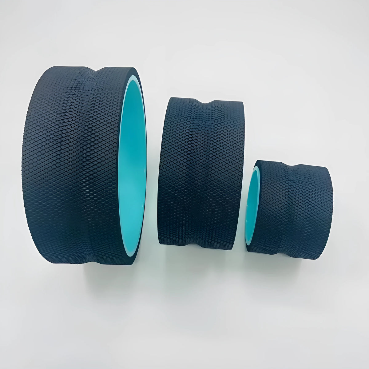 Yoga wheel set in black, available as four-piece or three-piece yoga aid with skin green tube colour option