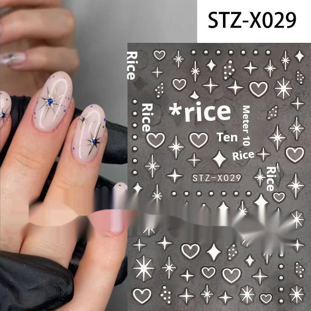 Assortment of black and silver nail sticker designs including cartoon and French tip patterns on a plastic sheet.