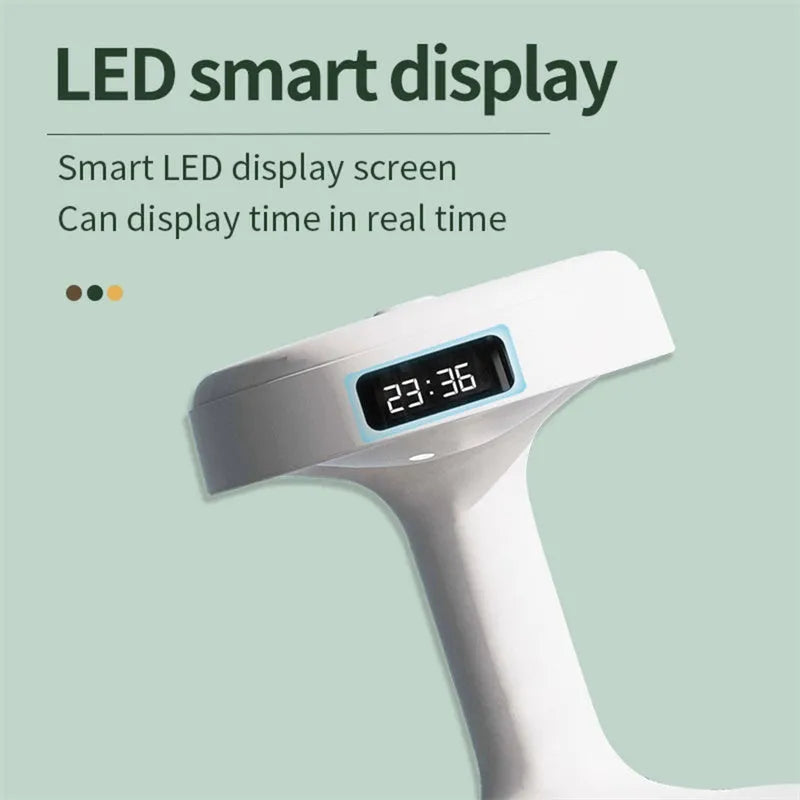 White columnar anti-gravity humidifier with water droplet backflow and LED clock display on a desk.