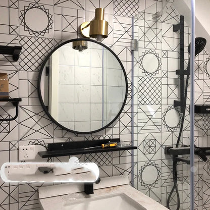 Round metal-framed wall mirror in black, white, or gold for bathroom.