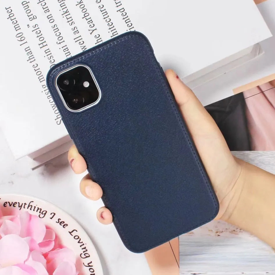Leather-textured TPU phone case for iPhone in black, brown, navy blue, or wine red colour options.