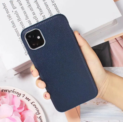 Leather-textured TPU phone case for iPhone in black, brown, navy blue, or wine red colour options.