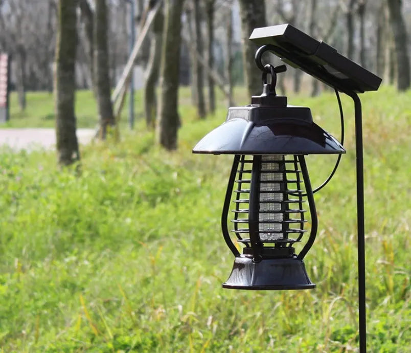 White solar mosquito lamp for outdoor garden use with solar panel and LED lights.
