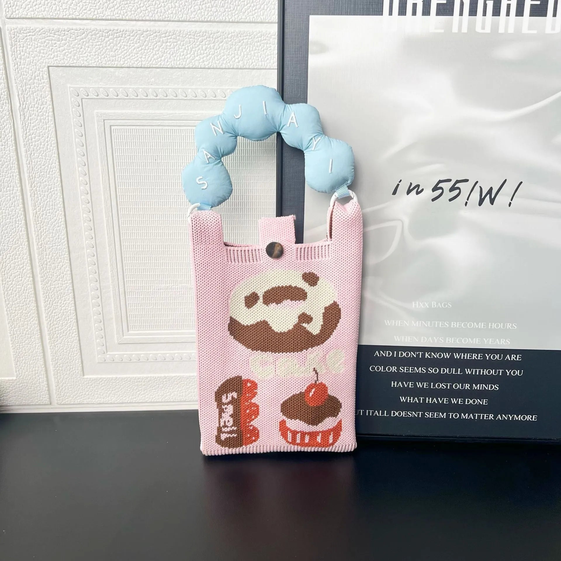 Cartoon knitted messenger bag with polyester construction and internal mobile phone storage