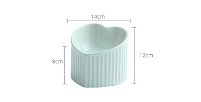 Elevated ceramic pet bowl with tilted design for comfortable and healthy feeding