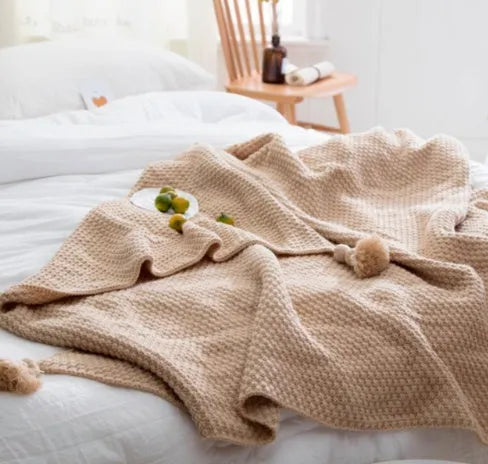 Nordic fringed knit ball acrylic blanket in beige colour measuring 130×170cm