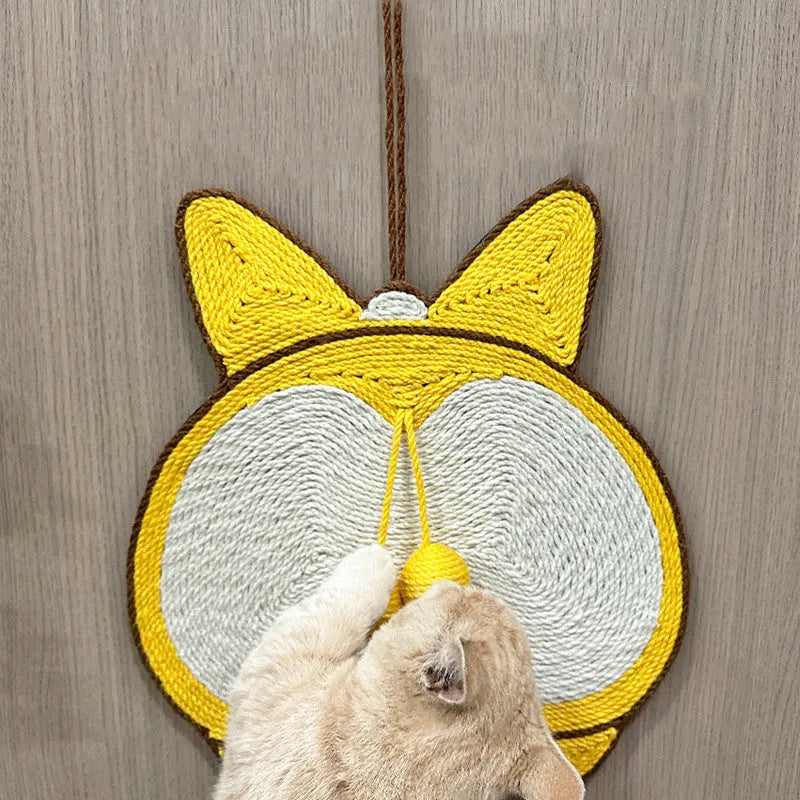 Yellow Corgi-butt design sisal cat scratching pad with anti-slip base, shown with adhesive hooks for wall mounting.