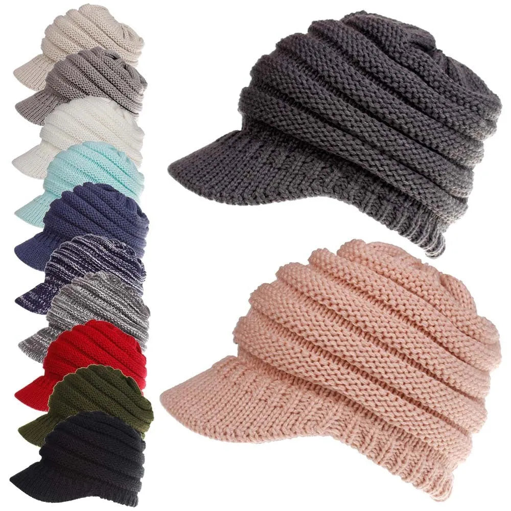 Women's acrylic knitted ponytail beanie in a solid colour, shown on a model with a ponytail.