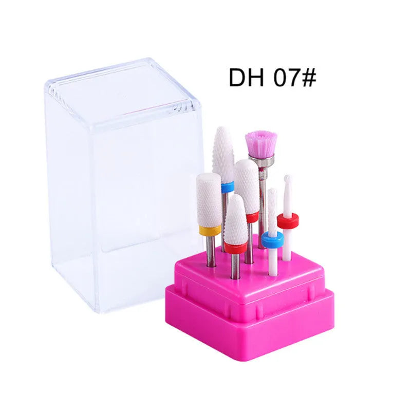 Set of six tungsten steel nail drill bits and a brush in a clear plastic case.