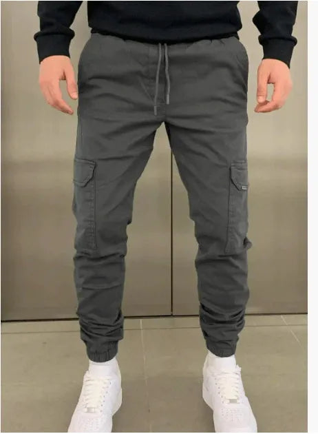 Men's loose-fit straight-leg polyester trousers in Army Green with elastic waistband and patch pockets