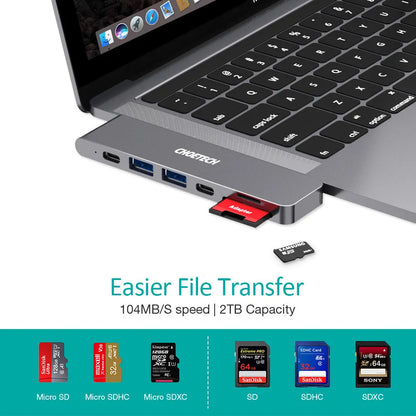 Silver aluminium USB-C hub adapter with SD card slot, Micro SD slot, HDMI, USB ports, and USB-C connector.
