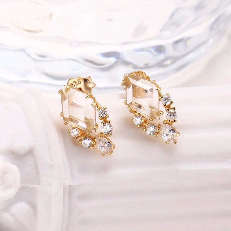 Geometric sterling silver ear studs with sweet white crystal stones