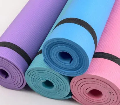 EVA composite fitness and yoga mat in blue, showing its texture and rolled edge next to a storage bag.