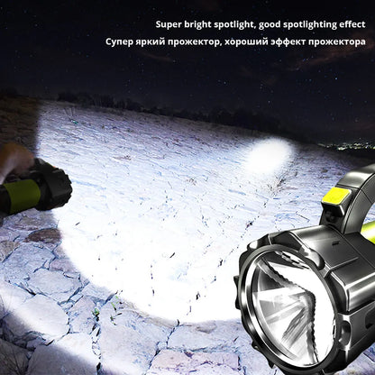 H771 portable LED searchlight in orange or green with shoulder strap and removable battery.