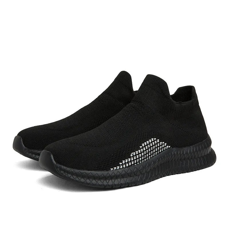 Low-top casual sneaker in Popcorn Flyknit fabric, showing flat heel and round toe design.