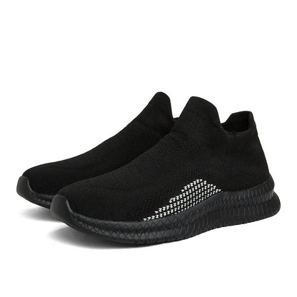 Low-top casual sneaker in Popcorn Flyknit fabric, showing flat heel and round toe design.