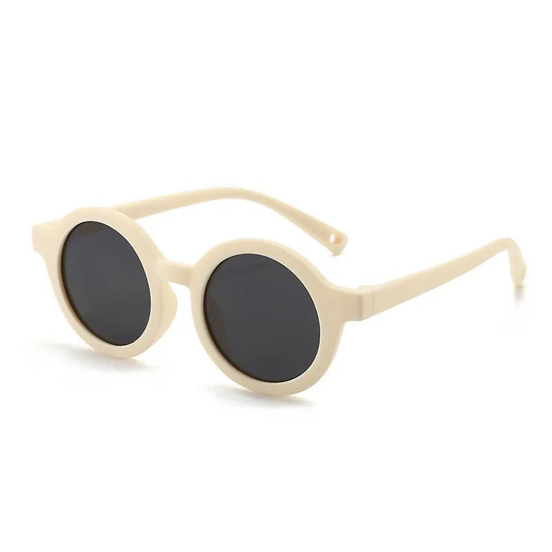 Children's round-frame polarised sunglasses with soft TPEE frame for ages 0-3, shown in assorted colours.