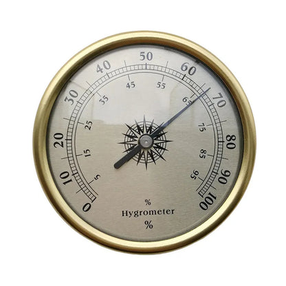 Analogue thermometer and hygrometer with aluminium outer ring and dial showing temperature and humidity scales