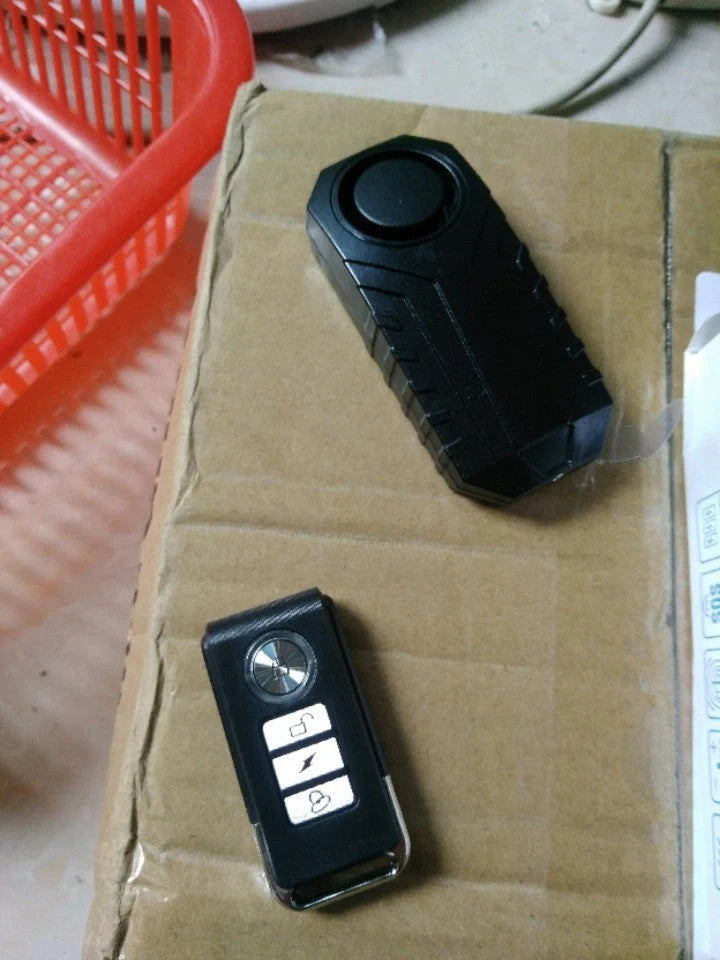 Electric vehicle remote alarm with black PC case and installation accessories