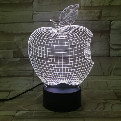 Colourful 3D fruit design LED night light with touch control on a table.