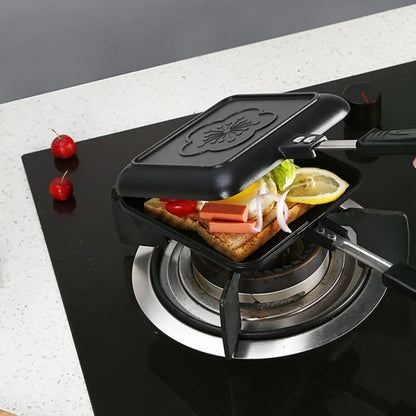 Black double-sided aluminium sandwich pan measuring 34cm with heat-proof handle for cooking