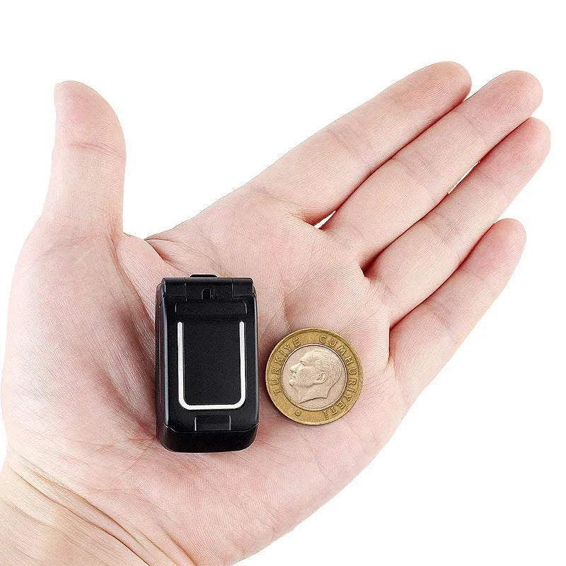 Mini flip mobile phone in gold, shown with flip cover open, on a white background.