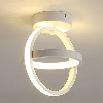 Modern round ceiling light with 21cm diameter and 25cm height in black or white finish