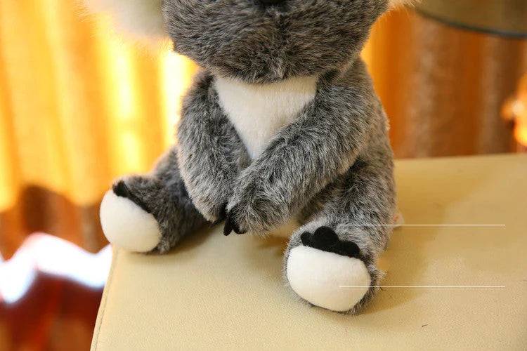 A soft, cuddly koala plush toy with short, premium plush fur and 100% pure cotton filling, showcasing the high-quality British craftsmanship.
