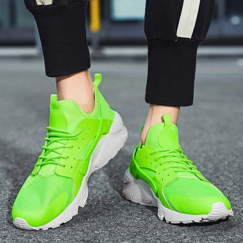 Men's low top casual shoes with mesh upper, cross shoulder straps, and flat heel in fluorescent colours