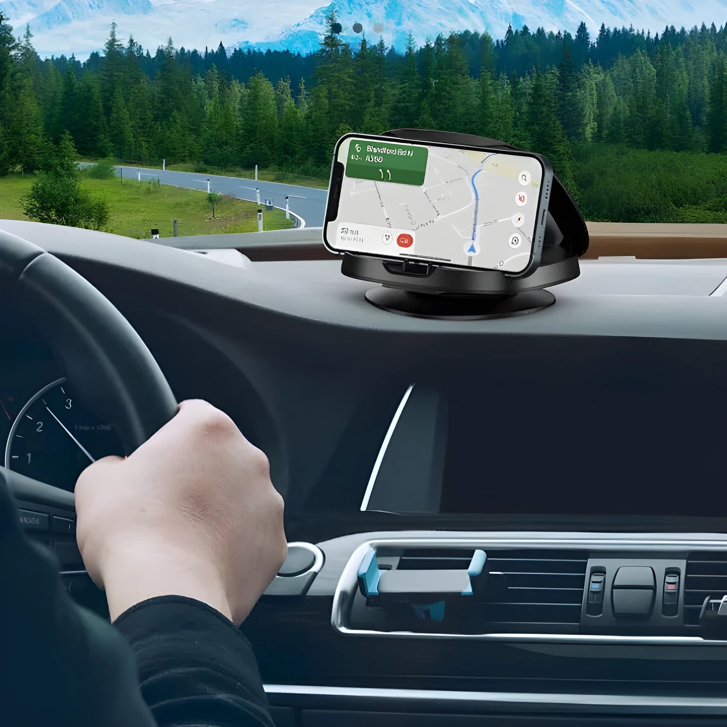 Black plastic rotating suction cup car navigator bracket mounted on a car windscreen