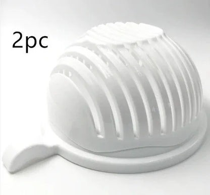 Blue salad cutter bowl showing cutting lid with seams, drain basket function, and reversible base plate