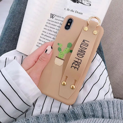 Green iPhone case with graffiti design and integrated wristband holder on back cover