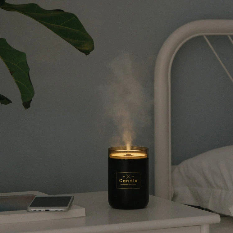 Compact USB-powered mist humidifier with mood light, available in fresh green, rose powder, and black colors