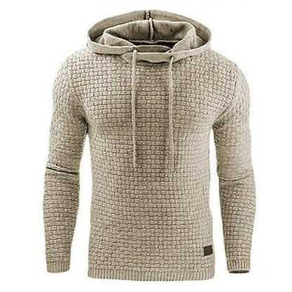 A man wearing a cotton-polyester blend hoodie available in nine colours including black, navy, and red.