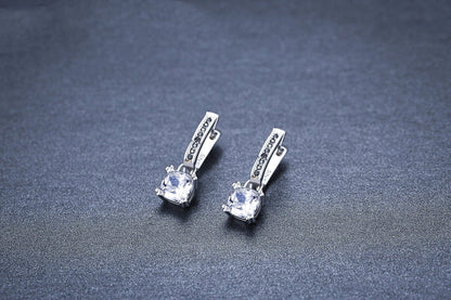 Copper-plated square zircon earrings with black inlay, modern geometric design