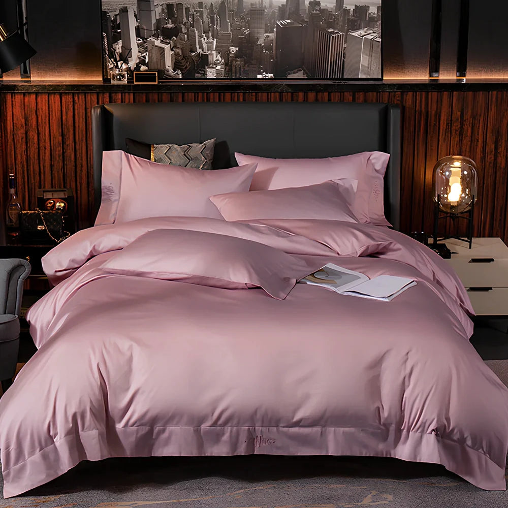 Four-piece cotton bedding set with satin weave fabric showing quilting detail and colour options