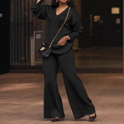 Women's brown suede two-piece suit with split sleeves on top and matching trousers