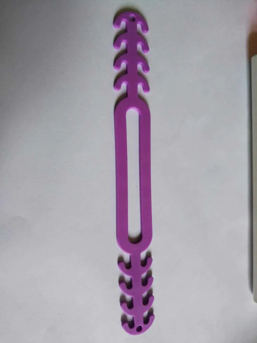 Adjustable anti-stroke mask belt in various colours, showing secure fit and durable design