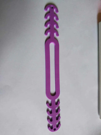 Adjustable anti-stroke mask belt in various colours, showing secure fit and durable design