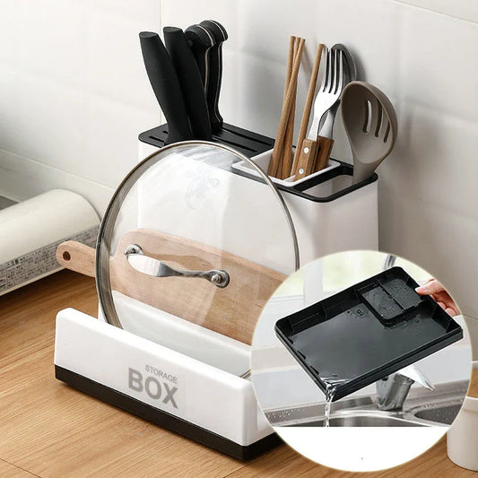 A modern, white plastic kitchen storage rack with integrated shelves for organizing cutlery, utensils, and tableware