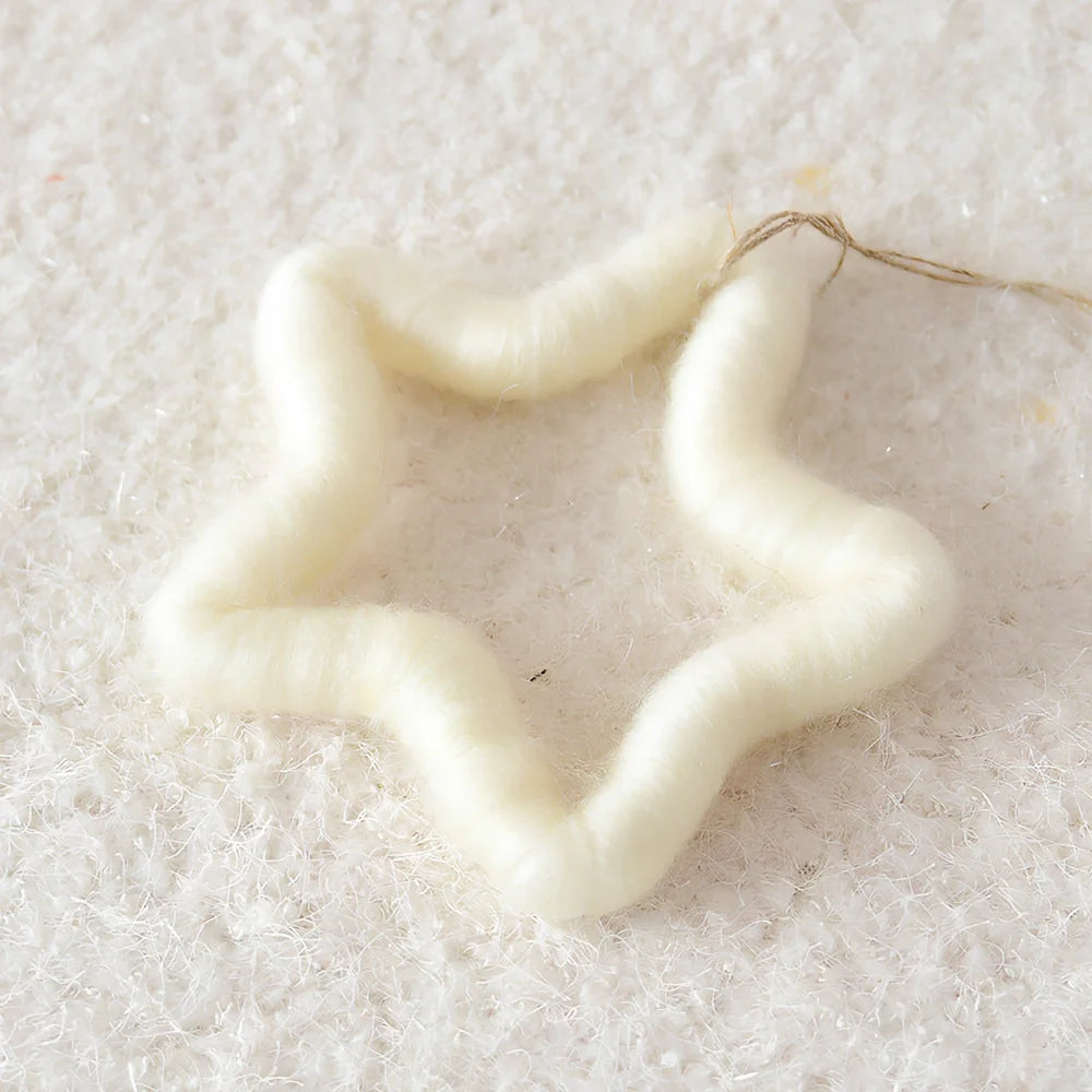 19cm wool felt snowflake and 13cm star Christmas decorations with intricate cut-out patterns