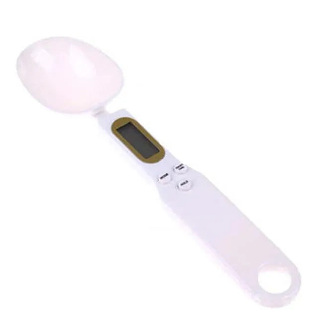 Black digital measuring spoon scale showing LCD display with weight reading