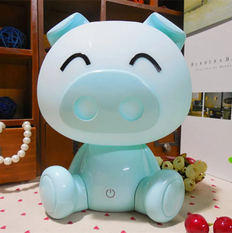 Cartoon pig small night lamp in ABS with 3W power, USB cable, power adapter, and blue, pink or yellow colour options.