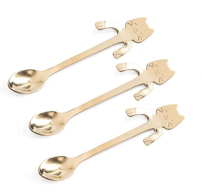 Stainless steel coffee spoon with cartoon cat handle showing hanging hole and smooth edges