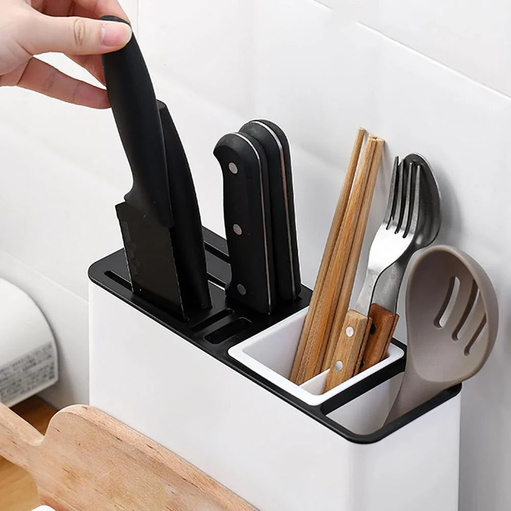 A modern, white plastic kitchen storage rack with integrated shelves for organizing cutlery, utensils, and tableware