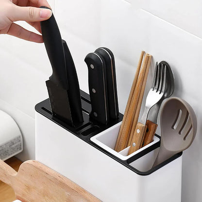 A modern, white plastic kitchen storage rack with integrated shelves for organizing cutlery, utensils, and tableware