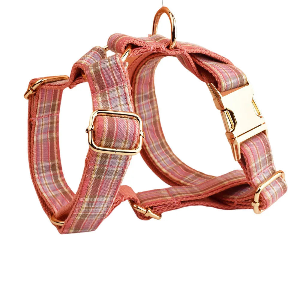 Red plaid cloth dog collar and leash set with matching bow on a white background